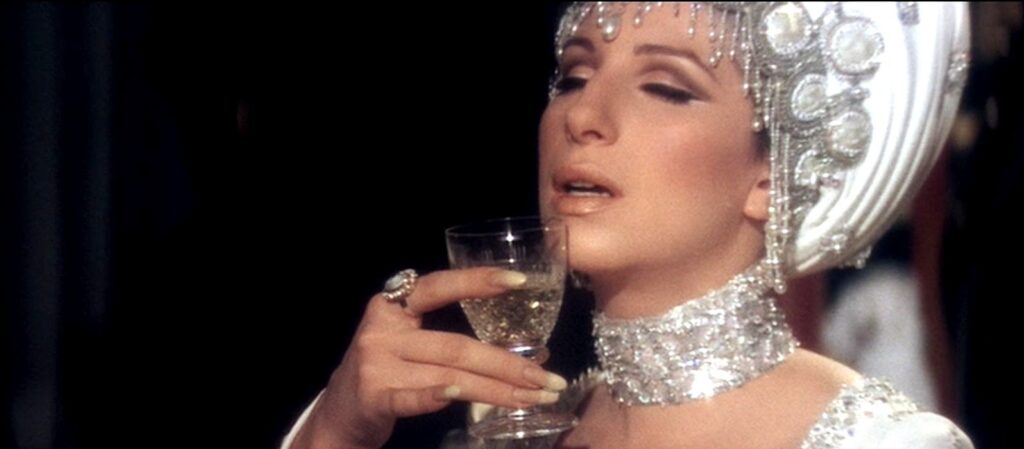 Barbra Streisand enjoying a drink